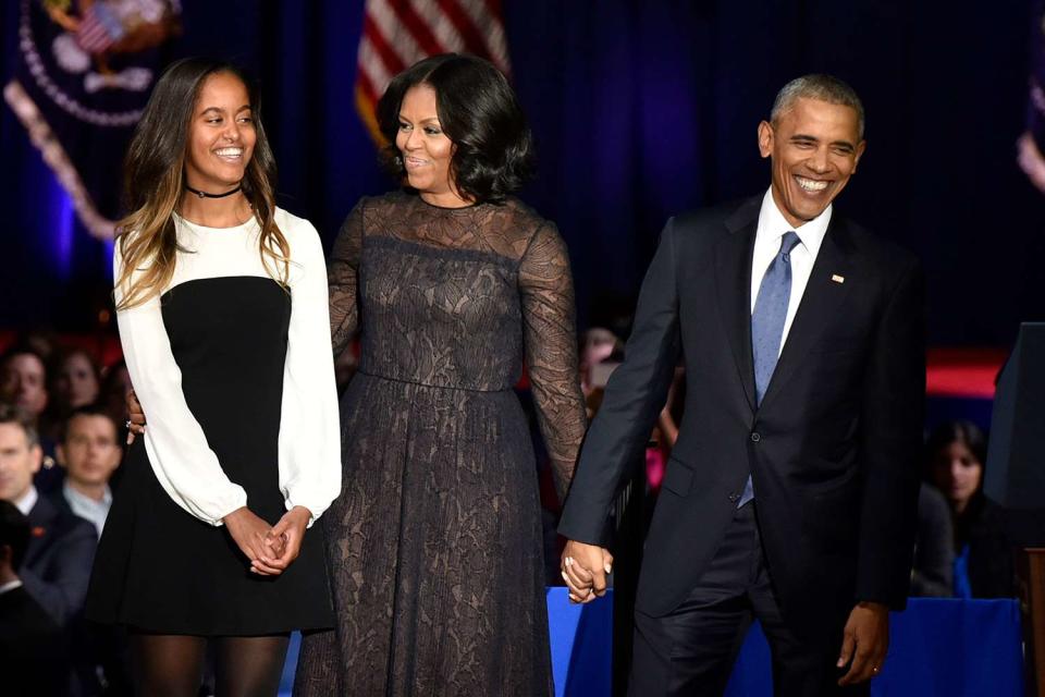 <p>Christopher Dilts/Bloomberg</p> From left: Malia, Michelle, and Barack Obama in 2017