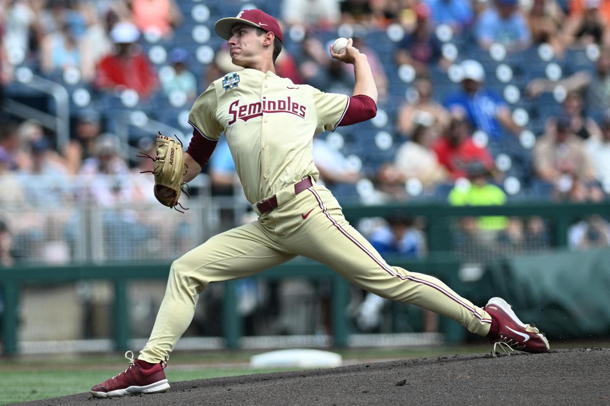 Jun 16, 2024; Omaha, NE, USA; Florida State Seminoles starting pitcher Carson Dorsey (9) throws against the Virginia Cavaliers during the first inning at Charles Schwab Field Omaha.