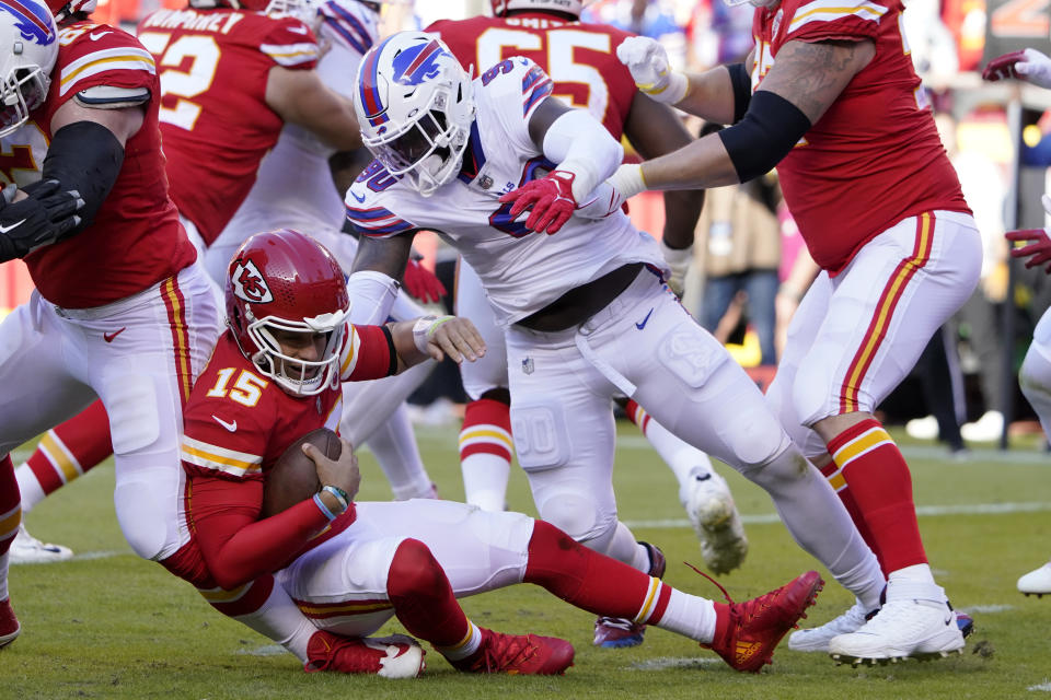 Kansas City Chiefs quarterback Patrick Mahomes (15) is sacked by Buffalo Bills defensive end Shaq Lawson (90) during the first half of an NFL football game Sunday, Oct. 16, 2022, in Kansas City, Mo. (AP Photo/Ed Zurga)