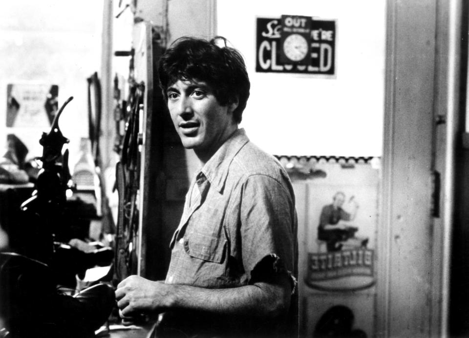 Al Pacino stands in a kitchen