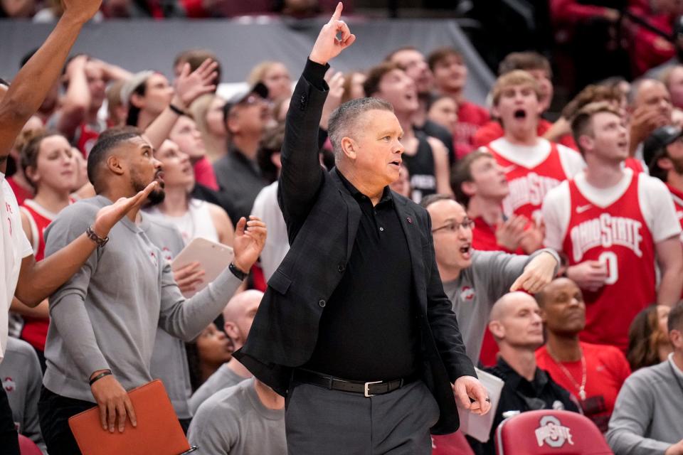 Mar 1, 2023; Columbus, Ohio, United States;  Ohio State Buckeyes head coach Chris Holtmann points to the video replay during the second half of the NCAA Division I basketball game between the Ohio State Buckeyes and the Maryland Terrapins at Value City Arena on Wednesday night. Mandatory Credit: Joseph Scheller-The Columbus Dispatch