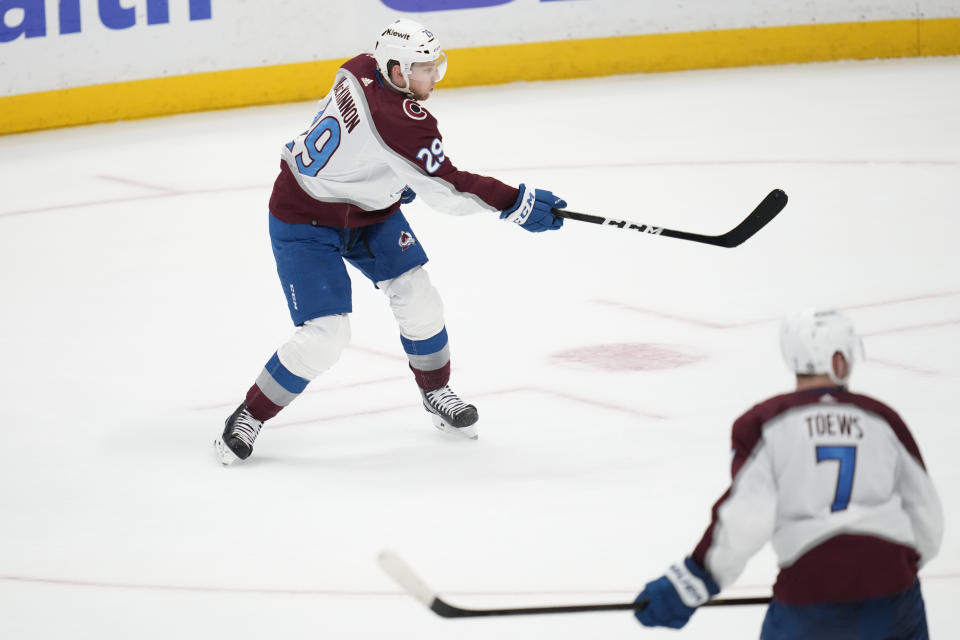 Colorado Avalanche center Nathan MacKinnon (29) shoots and scores during overtime of an NHL hockey game against the Anaheim Ducks in Anaheim, Calif., Sunday, April 9, 2023. The Avalanche won 5-4. (AP Photo/Ashley Landis)