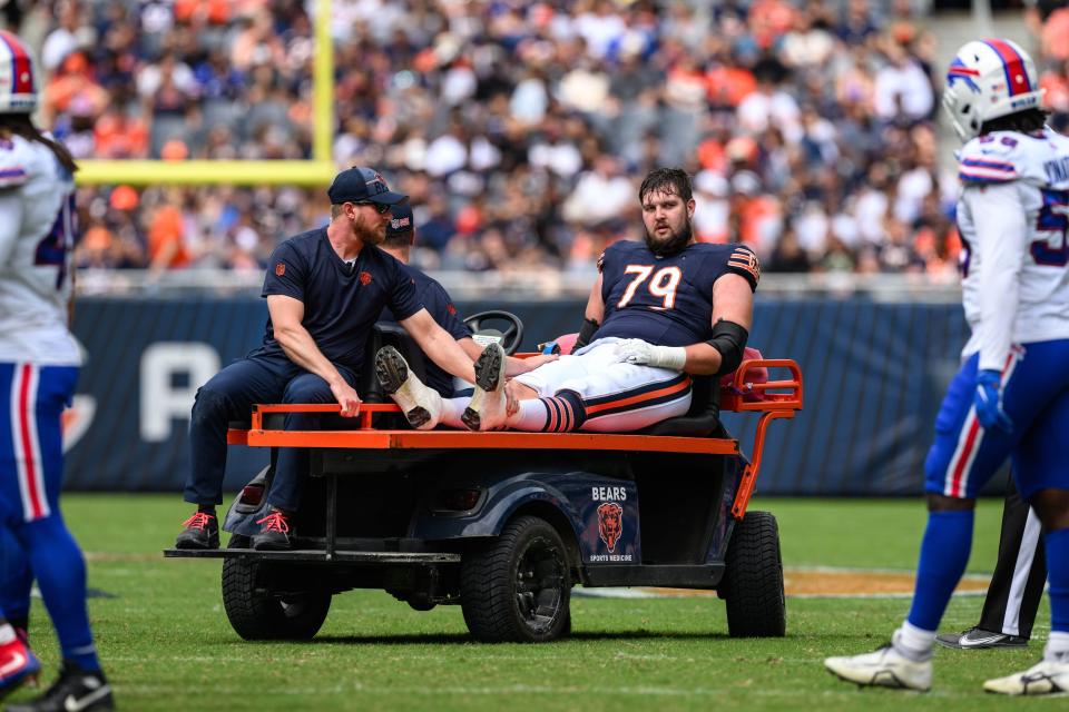 Chicago Bears offensive tackle Gabe Houy (79) is carted off the field after suffering an apparent injury during the third quarter against the Buffalo Bills at Soldier Field.