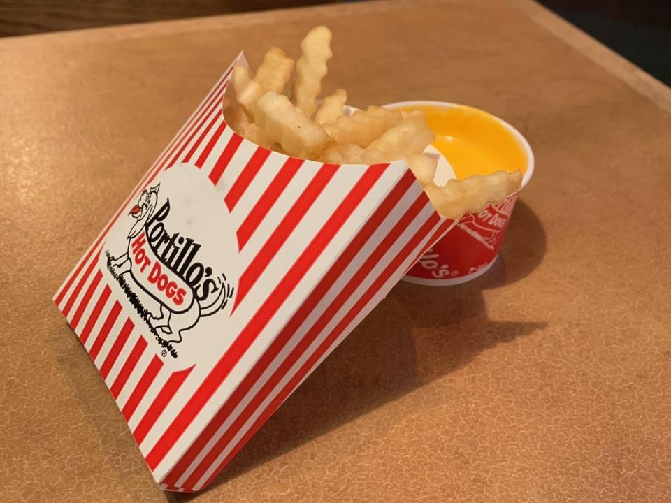 order of portillos french fries with a side of cheese sauce