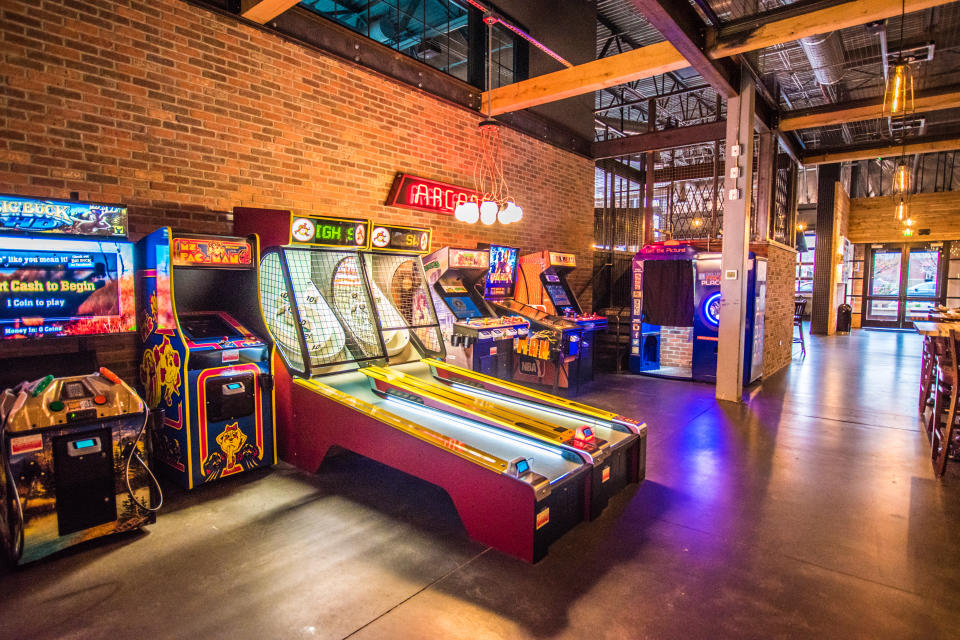 Classic arcade games can be found at Punch Bowl Socials. [Photo credit: Amber Boutwell, Punch Bowl Social]