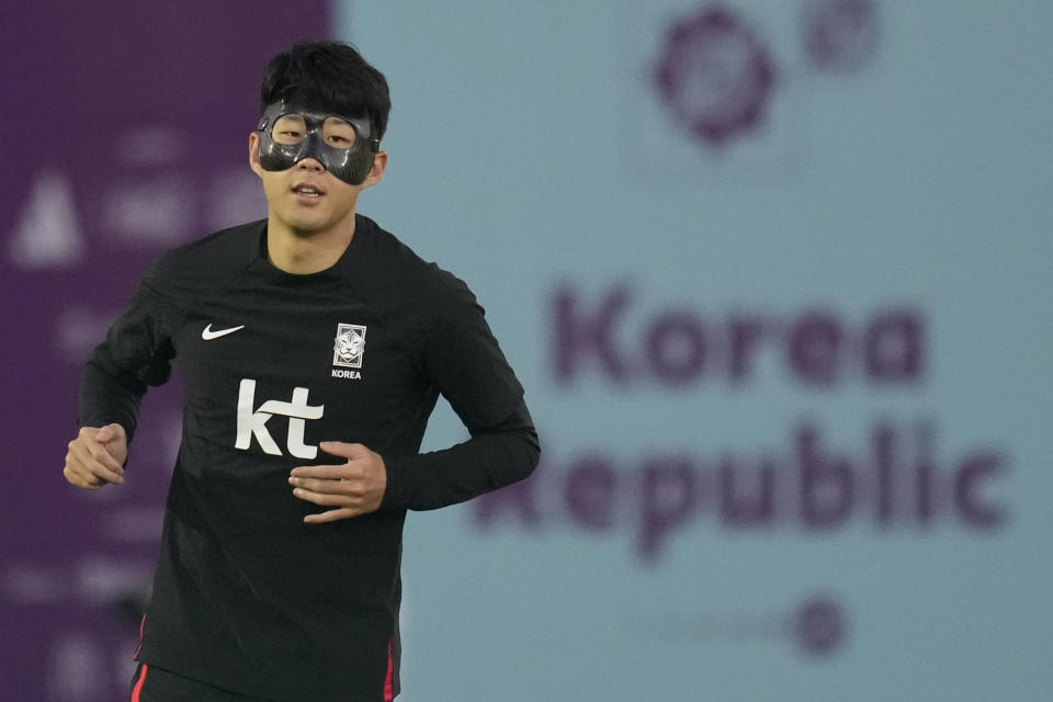 South Korea's Son Heung-min warms up during a training session at Al Egla Training Site 5 in Doha, Qatar, Tuesday, Nov. 22, 2022. South Korea will play its first match in Group H in the World Cup against Uruguay on Nov. 24. (AP Photo/Lee Jin-man)