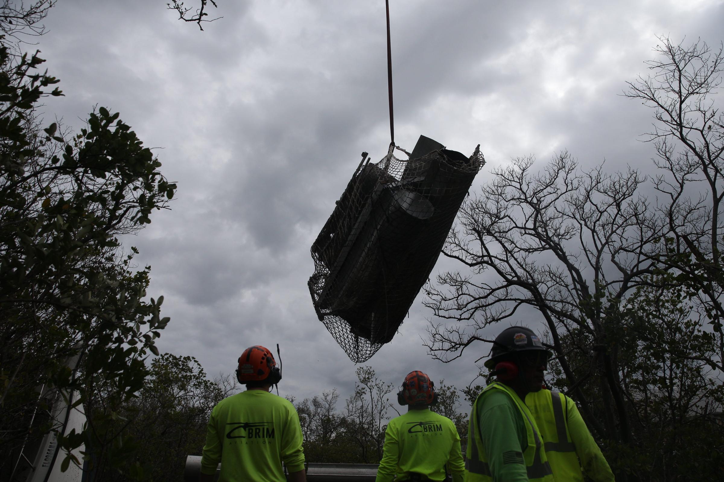 Boat removal from mangroves at Estero Cove Condominiums