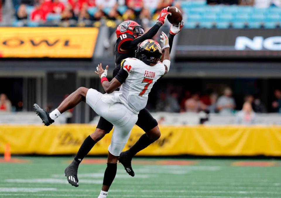 N.C. State safety Rakeim Ashford (16) intercepts the ball intended for Maryland wide receiver Dontay Demus Jr. (7) during the second half of Maryland’s 16-12 victory over N.C. State in the Duke’s Mayo Bowl at Bank of America Stadium in Charlotte, N.C., Friday, Dec. 30, 2022.