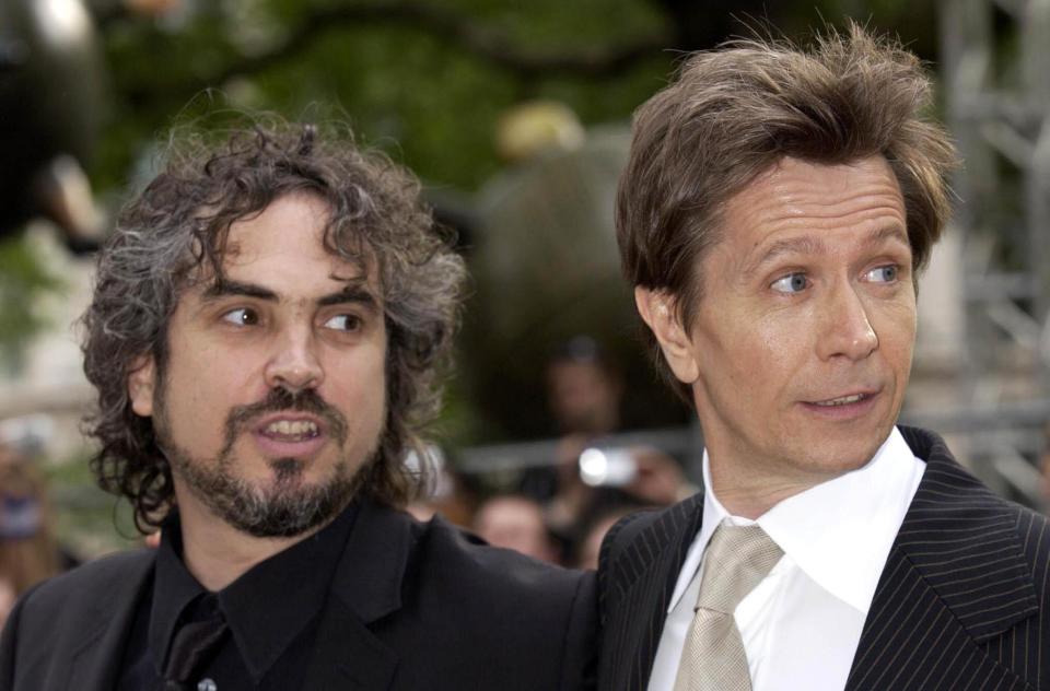 Director Alfonso Cuaron (left) and actor Gary Oldman arrive for the UK premiere of Harry Potter And The Prisoner of Azkaban at the Odeon Leicester Square in Central London, the third film from author JK Rowling's series of books on the boy wizard.   (Photo by Yui Mok - PA Images/PA Images via Getty Images)