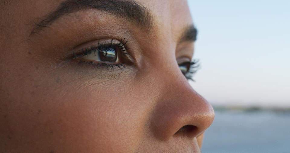 Closeup shot of an attractive young woman taking in all the sights at the beach