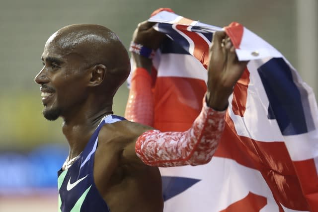 Sir Mo Farah celebrates after winning the men's one hour race and setting a new world record 