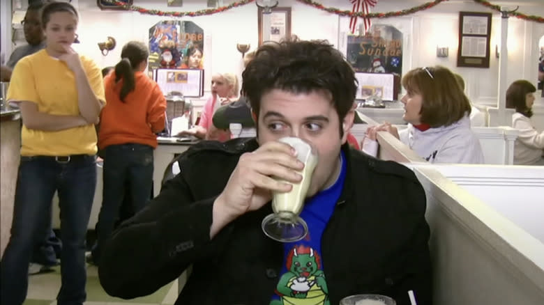 Adam Richman drinking milkshakes