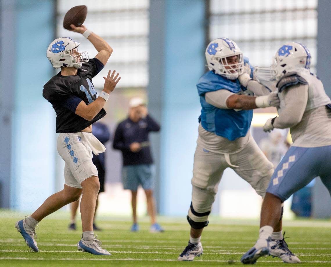 North Carolina graduate transfer quarterback Max Johnson (14) works from the pocket during the Tar Heels’ scrimmage on Thursday, April 11, 2024 in Chapel Hill, N.C. Robert Willett/rwillett@newsobserver.com