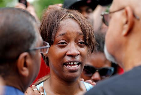 Diamond Reynolds weeps after she recounts the incidents that led to the fatal shooting of her boyfriend Philando Castile by Minneapolis area police during a traffic stop on Wednesday, at a "Black Lives Matter" demonstration in front of the Governor's Mansion in St. Paul, Minnesota. REUTERS/Eric Miller