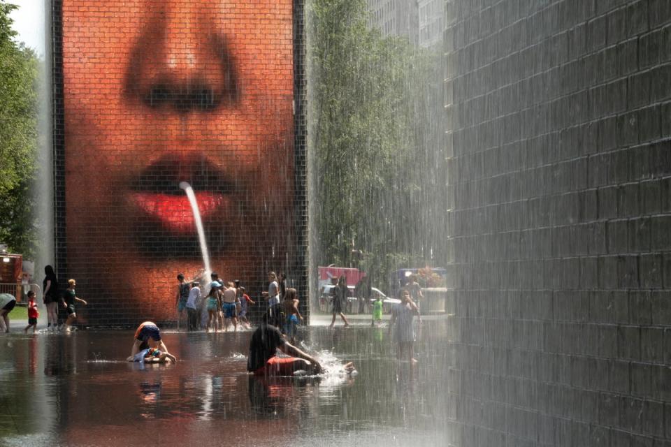 People cool off at Crown Fountain in Millennium Park as temperatures reached a record high of 97 degrees Fahrenheit on June 17, 2024 in Chicago, Illinois. Temperatures in the city are expected to reach highs in the 90s for the remainder of the week (Getty Images)
