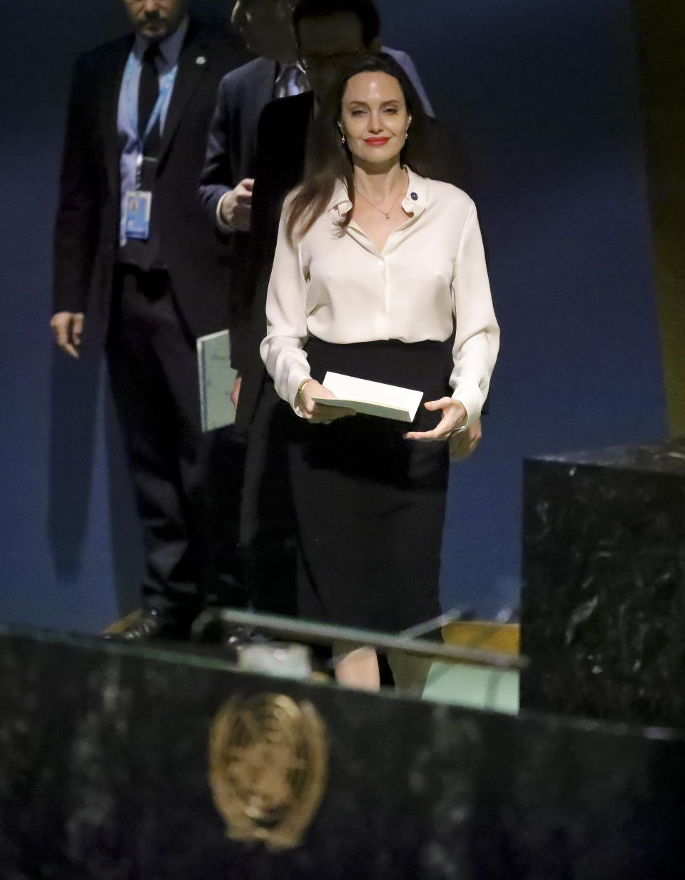 Angelina Jolie, United Nations High Commissioner for Refugees special envoy, approach the U.N. General Assembly podium to address a meeting on U.N. peacekeeping at U.N. headquarters, Friday March 29, 2019. (AP Photo/Bebeto Matthews)