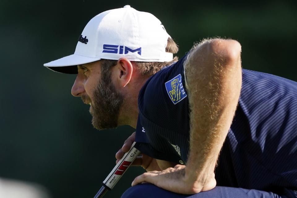 Dustin Johnson lines up a putt on the 10th green during the final round of the Northern Trust golf tournament at TPC Boston, Sunday, Aug. 23, 2020, in Norton, Mass. (AP Photo/Charles Krupa)