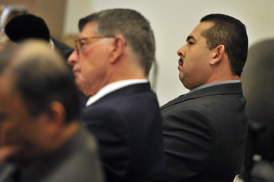 Former Fullerton police officer Manuel Ramos listens to Orange County district attorney Tony Rackauckas' closing argument in the case against Ramos and fellow former officer Jay Cicinelli in Santa Ana, Calif. Cicinelli and Ramos pleaded not guilty in the beating death of Kelly Thomas, 37, a mentally ill homeless man. Thomas died five days after a violent struggle with officers who were responding to a report of a man breaking into cars at a transit hub. (AP Photo/The Orange County Register, Joshua Sudock, Pool)