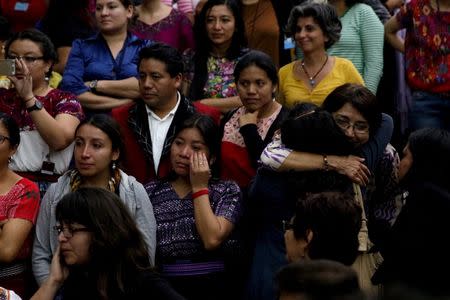 People react after a verdict was given in the Sepur Zarco case in Guatemala City, Guatemala, February 26, 2016. A judge sentenced Guatemalan Army Colonel Esteelmer Reyes Giron to 120 years and ex-military commissioner Heriberto Valdez to 240 years in prison for committing crimes against humanity, as well as sexual violence and slavery against fifteen indigenous women of the Mayan ethnic Q'eqchi group, between 1982 to 1986 at the military base of Sepur Zarco, during Guatemala's bloody 36-year civil war, local media reported. REUTERS/Josue Decavele - RTS87LW