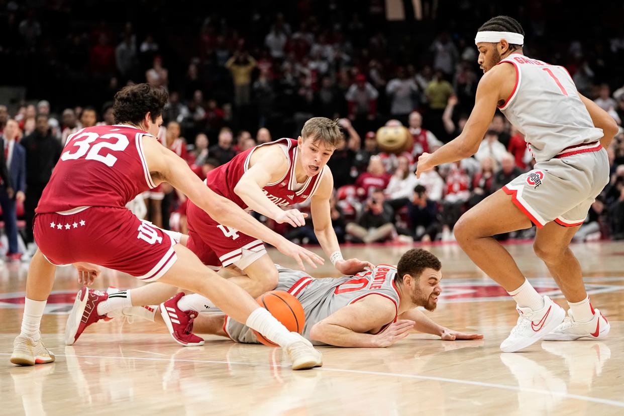 Feb 6, 2024; Columbus, Ohio, USA; Ohio State Buckeyes forward Jamison Battle (10) loses the ball to Indiana Hoosiers guard Trey Galloway (32) during the second half of the men’s basketball game at Value City Arena. Ohio State lost 76-73.
