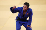 Naohisa Takato, of Japan, celebrates after defeating Yang Yung-wei, of Taiwan, in a men's 60-kg judo gold medal match at the 2020 Summer Olympics, Saturday, July 24, 2021, in Tokyo. (AP Photo/Jae C. Hong)