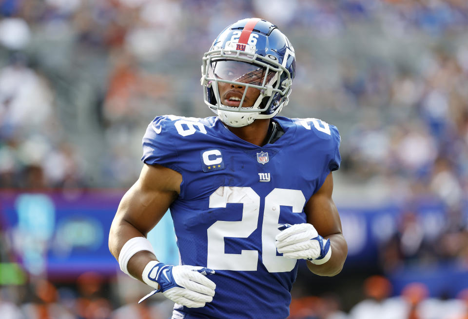 EAST RUTHERFORD, NEW JERSEY - SEPTEMBER 12: Saquon Barkley #26 of the New York Giants looks on during the game against the Denver Broncos at MetLife Stadium on September 12, 2021 in East Rutherford, New Jersey. (Photo by Tim Nwachukwu/Getty Images)