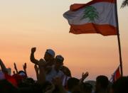 Demonstartors chant slogans during an anti-government protest in the southern city of Tyre