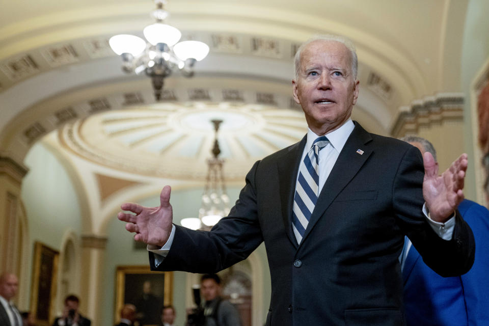 President Joe Biden speaks with members of the media after leaving a meeting with fellow Democrats at the Capitol in Washington, Wednesday, July 14, 2021, to discuss the latest progress on his infrastructure agenda. (AP Photo/Andrew Harnik)