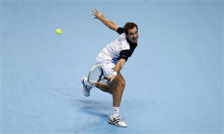 Richard Gasquet of France hits a return during his men's singles tennis match against Juan Martin Del Potro of Argentina at the ATP World Tour Finals at the O2 Arena in London November 4, 2013. REUTERS/Suzanne Plunkett