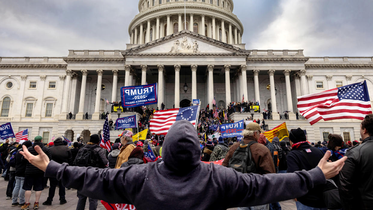 Pro-Trump protesters gather in front of the Capitol 