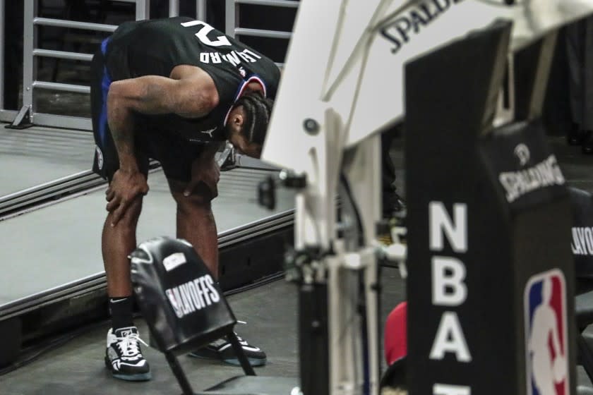 Los Angeles, CA, Monday, June 14, 2021 - LA Clippers forward Kawhi Leonard (2) bends over in pain after hurting his leg late in the game against the Utah Jazz in game four of the NBA Western Conference semifinals at Staples Center (Robert Gauthier/Los Angeles Times)