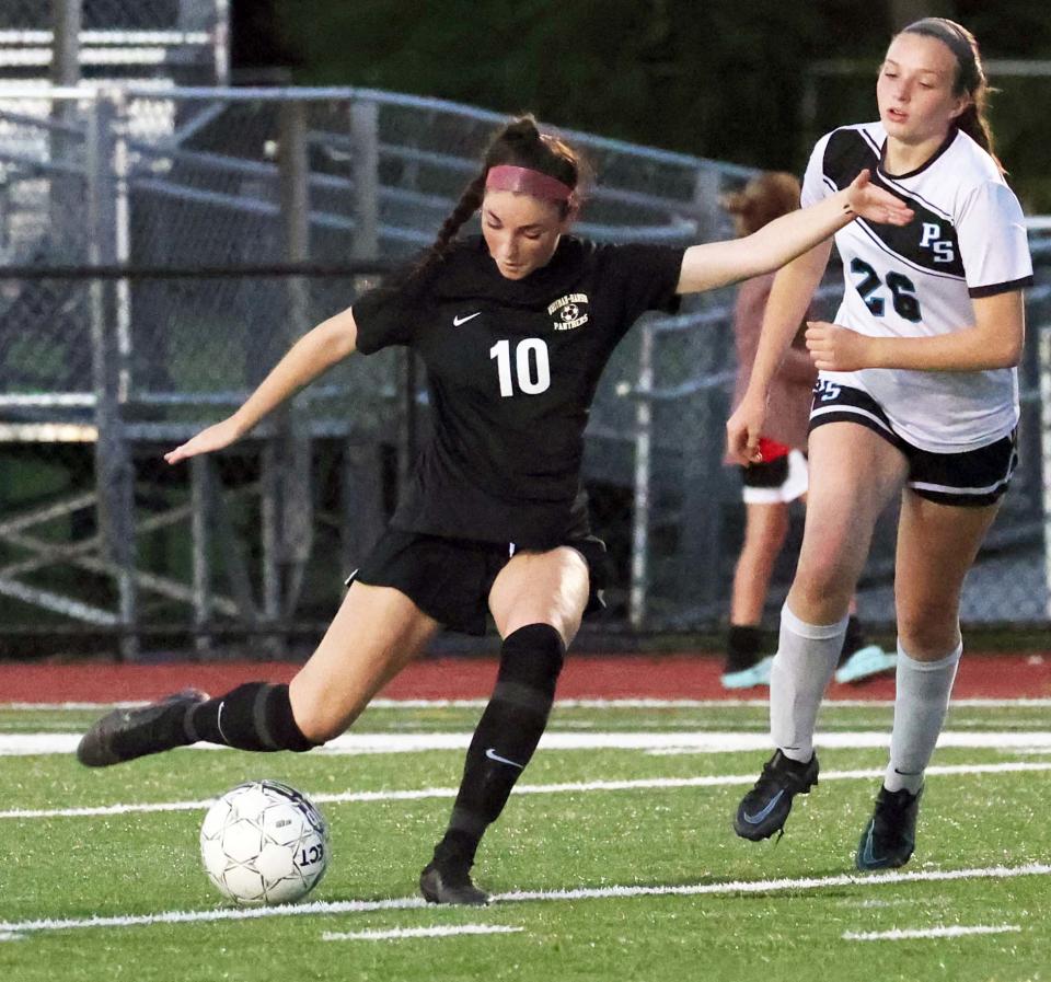 Whitman-Hanson's Makenna Marshall takes a shot on net around Plymouth South defender Isabella Kudrikow on Thursday, Sept. 15, 2022.  