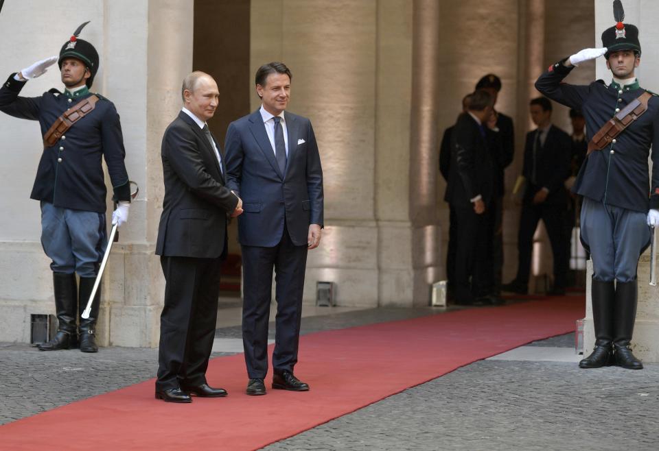 Russian President Vladimir Putin is welcomed at the Chigi palace by Italian Premier Giuseppe Conte, in Rome, Thursday, July 4, 2019. Putin emphasized historically strong ties with Italy during a one-day visit to Rome that included a meeting with Pope Francis. (Alexei Druzhinin, Sputnik, Kremlin Pool Photo via AP)