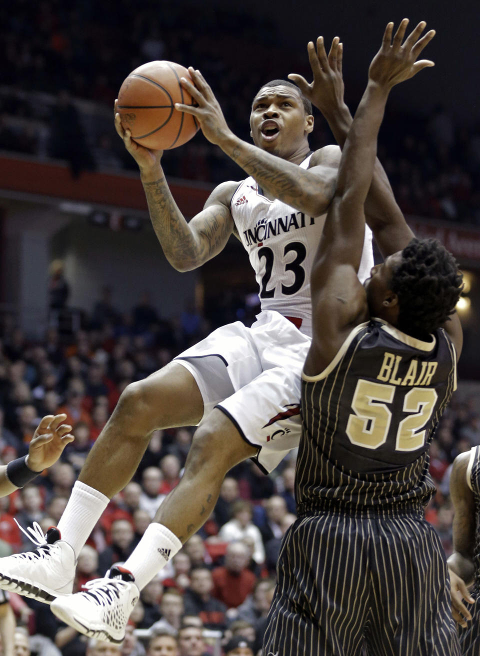 FILE - In this Jan. 23, 2014 file photo, Cincinnati guard Sean Kilpatrick (23) drives against Central Florida forward Staphon Blair (52) in the first half of an NCAA college basketball game in Cincinnati. Kilpatrick was selected to The Associated Press All-America team, released Monday, March 31, 2014. (AP Photo/Al Behrman)