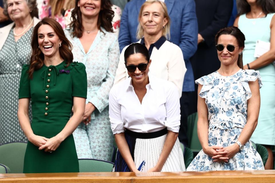 Kate Middleton (L), Meghan Markle and Pippa Middleton watch the Wimbledon women’s singles final together on July 13. - Credit: Shutterstock