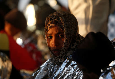 Migrants rest on the Malta-based NGO Migrant Offshore Aid Station (MOAS) ship Phoenix after being rescued from a rubber dinghy in the central Mediterranean in international waters off the coast of Sabratha in Libya, April 15, 2017. REUTERS/Darrin Zammit Lupi