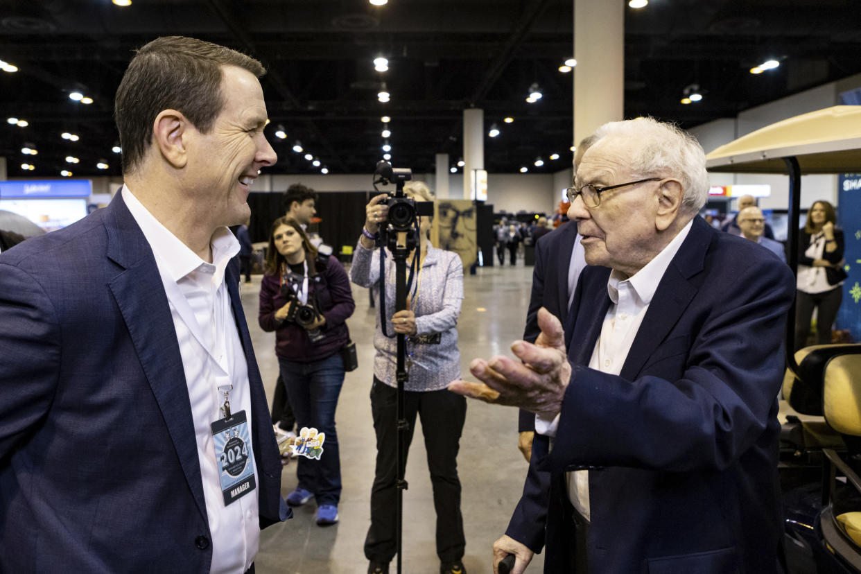 IMAGE DISTRIBUTED FOR SEE'S CANDIES - See's Candies President & CEO Pat Egan talks with Warren Buffett at the See's Candies booth at the Berkshire Hathaway Shareholder Meeting on Friday, May 3, 2024 in Omaha, Neb. (John Peterson/AP Images for See's Candies)