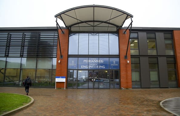 A student walks past the College of Engineering at Swansea University in south Wales.