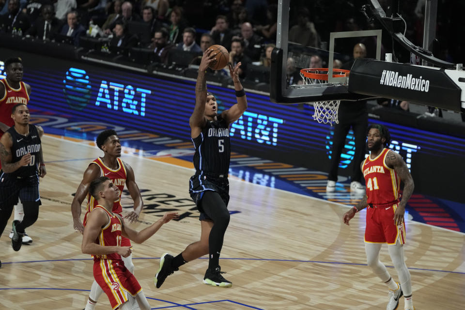 Orlando Magic's Paolo Banchero, goes up for a shot against the Atlanta Hawks, during the first half of an NBA basketball game, at the Mexico Arena in Mexico City, Thursday, Nov. 9, 2023. (AP Photo/Eduardo Verdugo)