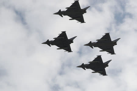 Eurofighter jets take part in a flypast as part of celebrations to mark Spain's National Day in Madrid, Spain October 12, 2017. REUTERS/Sergio Perez