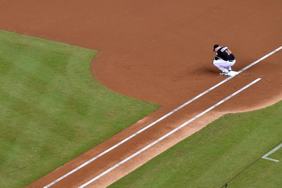 <p>Miami Marlins first baseman Justin Bour squats at first base prior to the game against the New York Mets at Marlins Park. Mandatory Credit: Jasen Vinlove-USA TODAY Sports </p>