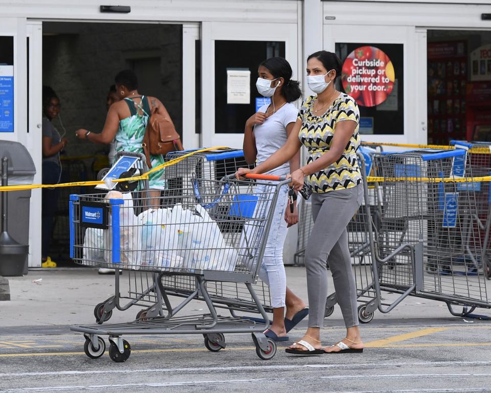 Shoppers at a Walmart in Coconut Creek, Florida, on Saturday as the chain's stores began limiting the number of customers inside. (mpi04/MediaPunch/IPx)