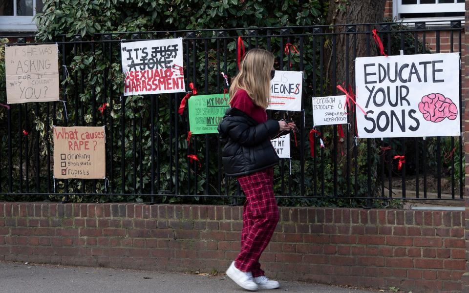 Protest signs are seen on railings at James Allen's Girls' School in Dulwich, London -  Eddie Mulholland