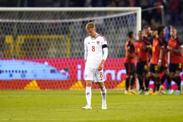 Wales' Matthew Smith looks dejected after Belgium's Kevin De Bruyne (hidden) celebrates scoring their side's first goal of the game with team-mtes during the UEFA Nations League Group D Match at King Baudouin Stadium, Brussels. Picture date: