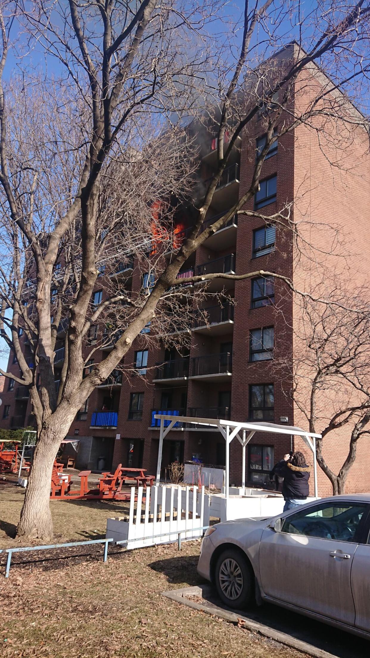 Four ambulances responded to a fire that broke out in a building on St-Jacques Street in Montreal's Saint-Henri neighbourhood Tuesday afternoon. (Erika Bisaillon/Radio-Canada - image credit)