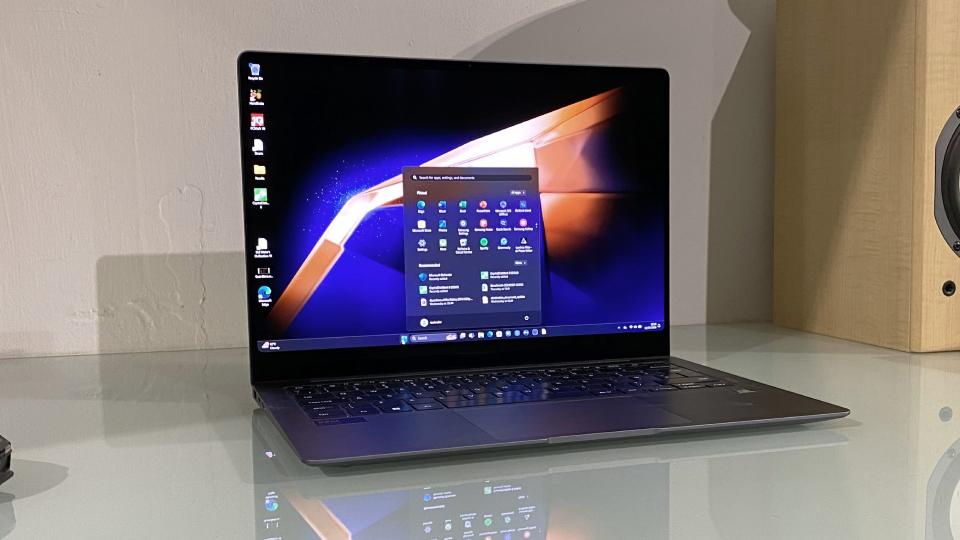  Samsung Galaxy Book4 Pro in use on a desk showing the screen. 