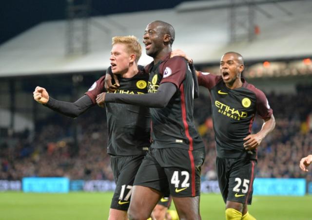 Manchester City's Yaya Toure (centre) celebrates with team-mates