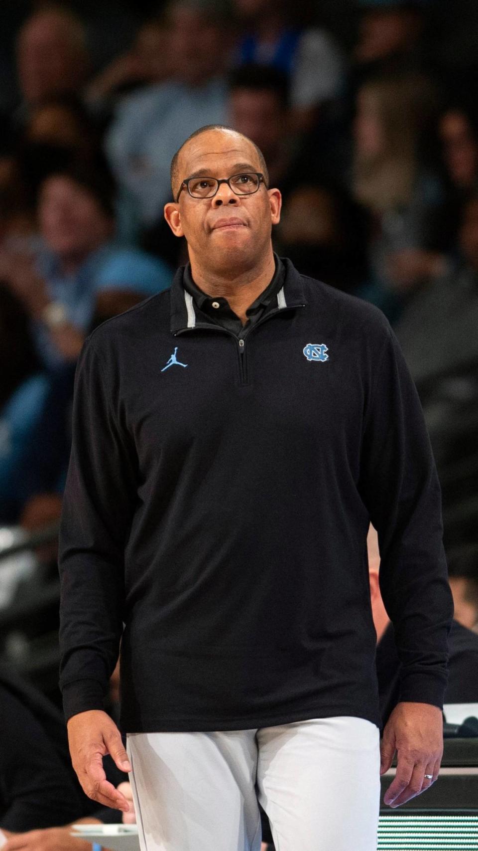 North Carolina head coach Hubert Davis watches the court during the first half of an NCAA college basketball game against Georgia Tech, Sunday, Dec. 5, 2021, in Atlanta. (AP Photo/Hakim Wright Sr.)