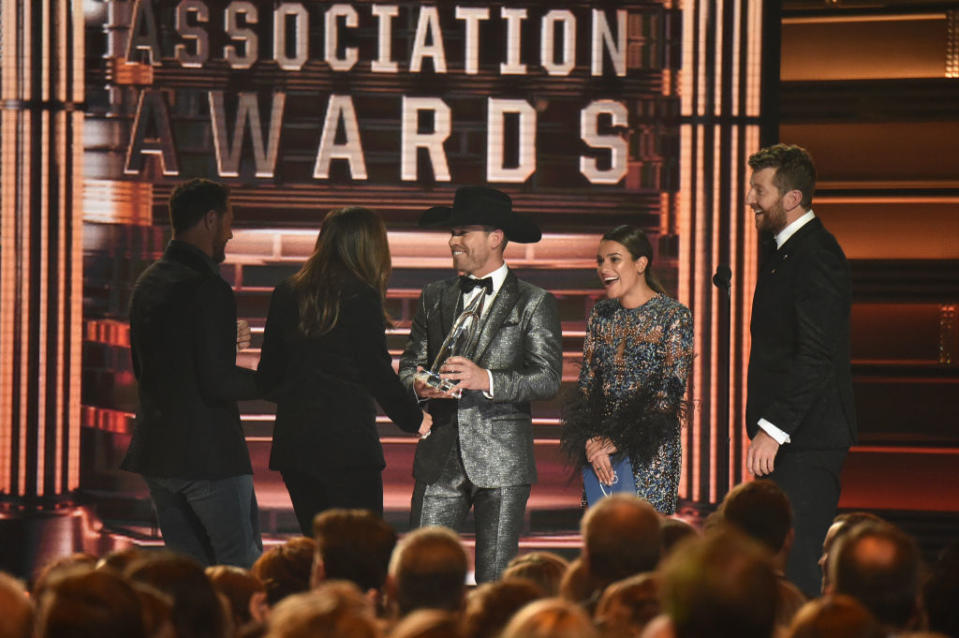 <p>Singer-songwriter Dustin Lynch, actress Lea Michele and singer Brett Eldredge present an award onstage during the 51st annual CMA Awards at the Bridgestone Arena on November 8, 2017 in Nashville, Tennessee. (Photo by John Shearer/WireImage) </p>