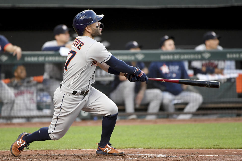 Houston Astros' Jose Altuve hits a two-run home run against the Baltimore Orioles in the fourth inning of a baseball game, Wednesday, June 23, 2021, in Baltimore. (AP Photo/Will Newton)